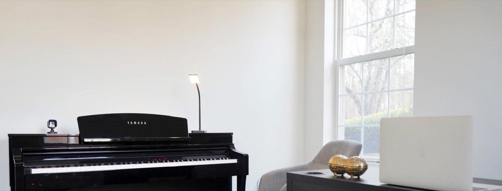 A teaching studio, with piano and natural light